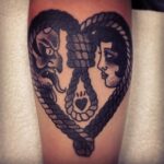 dark-grey-loop-in-the-form-of-love-heart-and-face-of-man-and-woman-in-the-middle-tattoo-376