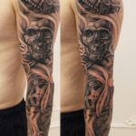 large-tattoo-with-skulls-and-various-tools-156